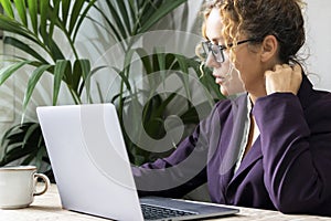 Portrait of pretty businesswoman working on laptop at office desk workplace. Elegant busy and confident pretty female people.