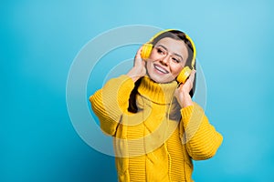 Portrait of pretty cheerful girl fan listening single hit modern jazz free time isolated over vivid blue color