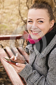 Portrait of pretty fashion blondie woman looking at camera. Shining smile.