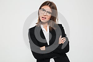 Portrait of a pretty frustrated businesswoman in suit