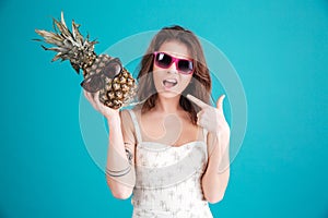 Portrait of a pretty funny summer girl in sunglasses