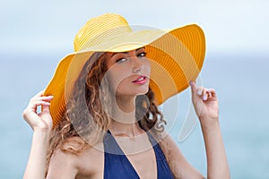 Portrait of pretty girl against sea