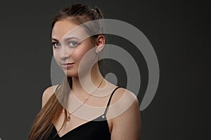 Portrait of a pretty girl in a black dress