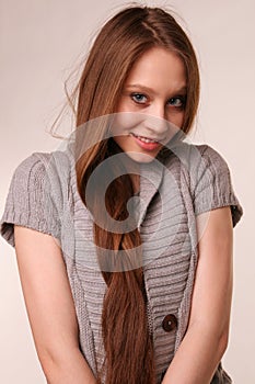 Portrait of pretty girl in grey woolen shirt.