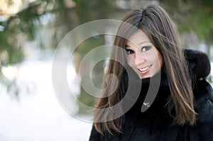 Portrait of pretty girl at winter backout