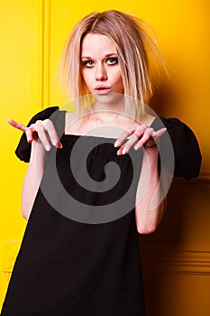 Portrait of pretty girl on yellow background