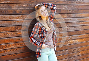 Portrait pretty happy girl posing in the city outdoors