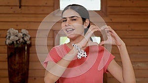 Portrait of a pretty Indian girl smiling and making a heart shape with her hands