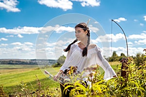 portrait of pretty Indian woman poses in a nature surrounding