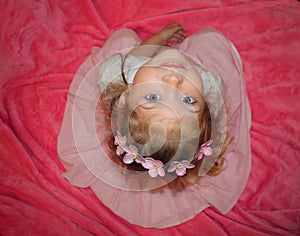 Portrait of a pretty little Cauasian young girl. Face shot of cute girl with headband. photo