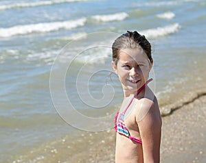 Portrait of pretty little girl with a bathing suit