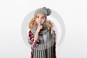 Portrait of a pretty little girl dressed in winter hat