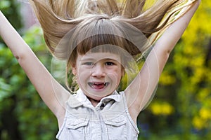 Portrait of a pretty little long-haired blond preschool girl in