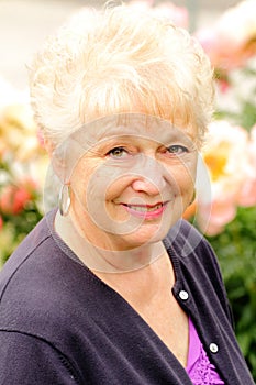 Portrait of a Pretty Older Lady with Flowers