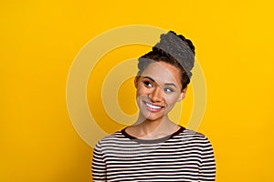 Portrait of pretty positive girl toothy smile look empty space imagine isolated on yellow color background