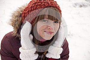 Portrait of pretty smiling girl in winter