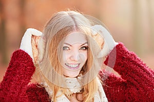 Portrait of pretty smiling woman in earmuffs.