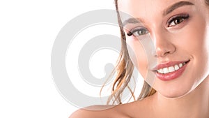 Portrait of pretty smiling woman with perfect white teeth with space for text. Young beautiful Caucasian female model