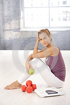 Portrait of pretty sporty girl in gym