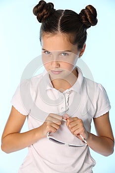 Portrait of a pretty stylish brunette child girl looks in disbelief