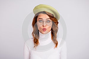 Portrait of pretty wavy-haired girl sending air kiss romance isolated over light gray white pastel color background