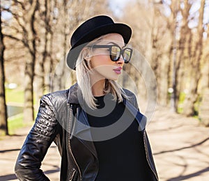 Portrait of Pretty Woman in black Hat Outdoors