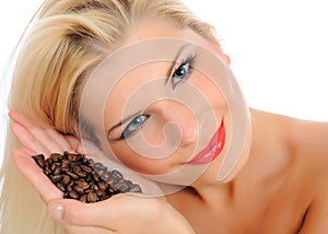 Portrait of pretty woman with coffee beans