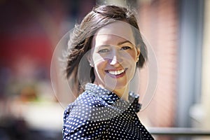 Portrait Of A Pretty Woman Smiling Outside