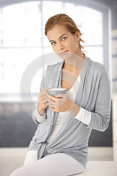 Portrait of pretty woman with tea mug