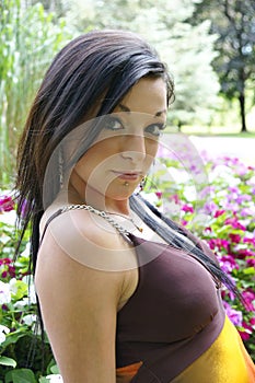 Portrait of pretty young brunette woman - outdoors