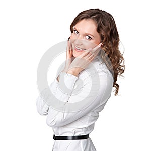 Portrait of pretty young businesswoman with hand on chin and smiling