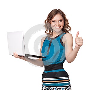 Portrait of a pretty young businesswoman holding a laptop