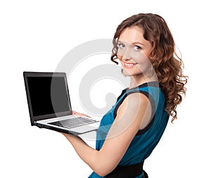 Portrait of a pretty young businesswoman holding a laptop