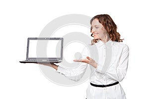 Portrait of a pretty young businesswoman holding a laptop