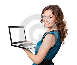 Portrait of a pretty young businesswoman holding a laptop