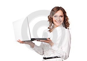 Portrait of a pretty young businesswoman holding a laptop