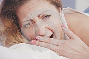 Portrait pretty young exhausted woman want to sleep on bed. Relax and health concept