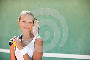 Portrait of a pretty, young, female tennis player