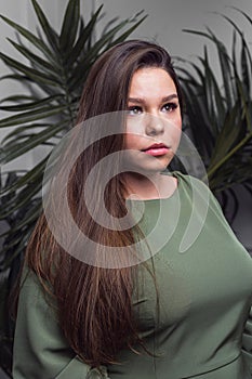 Portrait of pretty young smiling woman with beautiful hairstyling