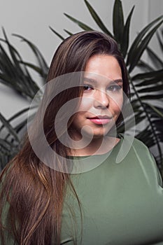 Portrait of pretty young smiling woman with beautiful hairstyling