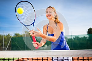 Portrait of a pretty young tennis player