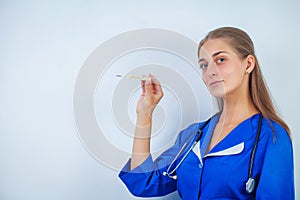 Portrait of pretty young woman doctor with stethoscope