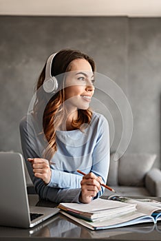 Portrait of a pretty young woman in headphones