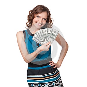 Portrait of pretty young woman holding a fan of dollar bills