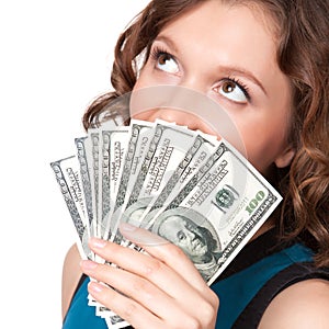 Portrait of pretty young woman holding a fan of dollar bills