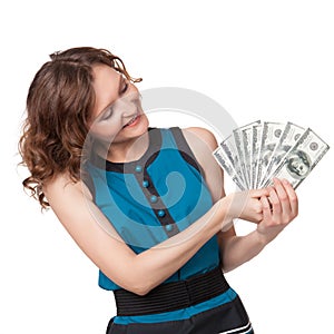 Portrait of pretty young woman holding a fan of dollar bills