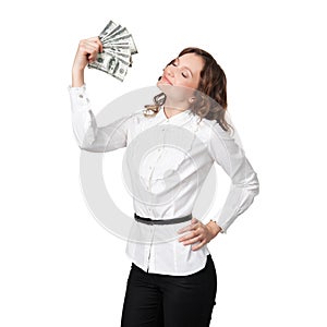 Portrait of pretty young woman holding a fan of dollar bills