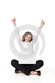 Portrait of a pretty young woman sitting in front of her laptop