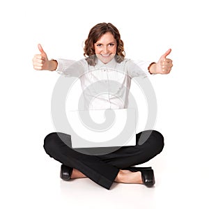 Portrait of a pretty young woman sitting in front of her laptop