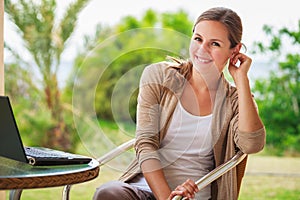 Portrait of a pretty young woman working on her computer